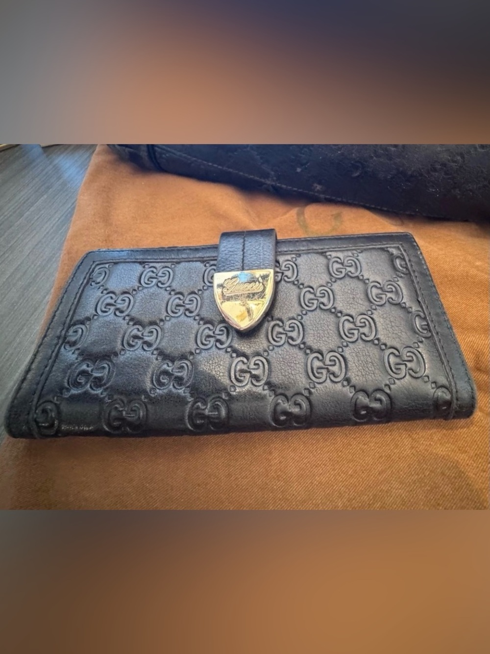 Gucci Black GG-Embossed Leather Wallet with Gold-Tone Crest